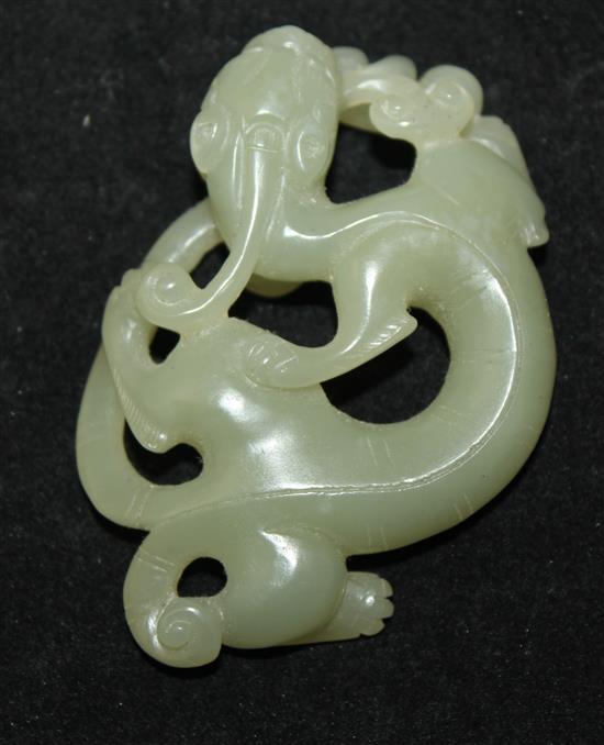 A Chinese celadon jade carving of a chi-dragon biting a sprig of lingzhi fungus, Qing dynasty, 6.9cm
